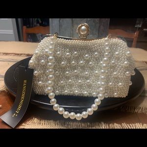 Brand NEW Woman’s Pearl Beaded Cream Clutch.